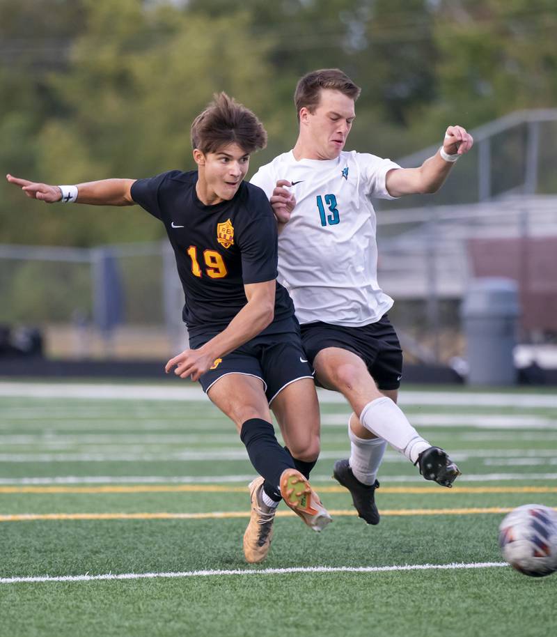 Richmond-Burton's Nick Kyes, left, collides with Woodstock North's Logan Barnes during their game on Wednesday, September 18, 2024 at Richmond-Burton High School in Richmond.