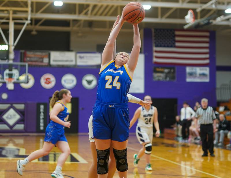 Johnsburg's Mackenzie McQuiston (24) rebounds the ball against Plano during a basketball game at Plano High School on Tuesday, Jan 30, 2024.