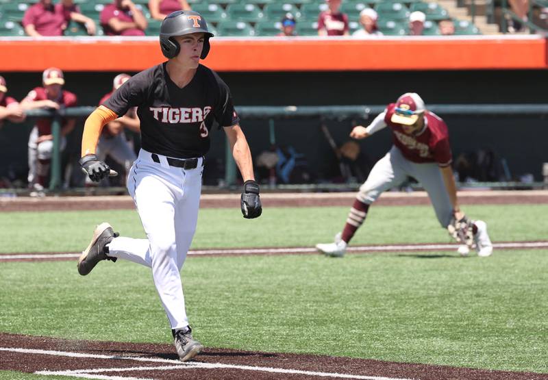 Crystal Lake Central's James Dreher beats out a bunt as Morris' Brett Bounds fields the ball during their Class 3A state semifinal game Friday, June 7, 2024, at Duly Health and Care Field in Joliet.