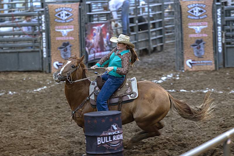 Colleen Vondra turns her second barrel in the Rice Bull Riding and Barrel Racing event Thursday, August 11, 2023 at the Carroll County fair.