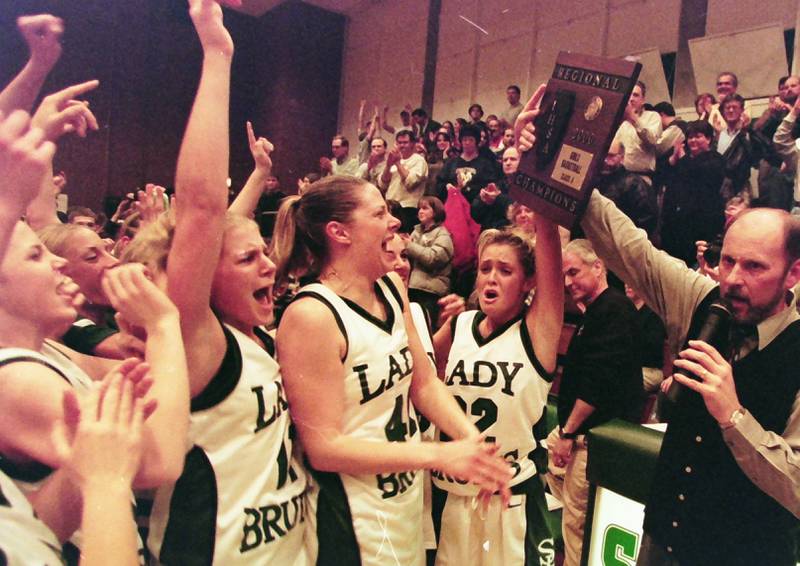 Members of the 2000 St. Bede Lady Bruins celebrate winning the Class 1A Regional title in 2000 at St. Bede Academy.