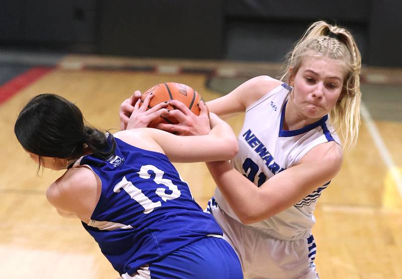 Newark’s Addison Ness and Hinckley-Big Rock's Mia Cotton fight for a loose ball Thursday, Jan. 18, 2024, during the Little 10 girls basketball tournament at Indian Creek High School in Shabbona.