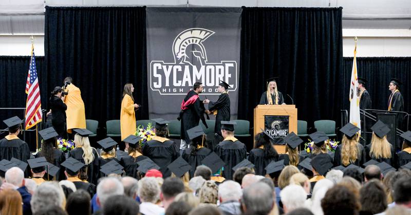 Graduates receive their diplomas during the 2024 Sycamore High School commencement in Sycamore on Sunday, May 26, 2024.