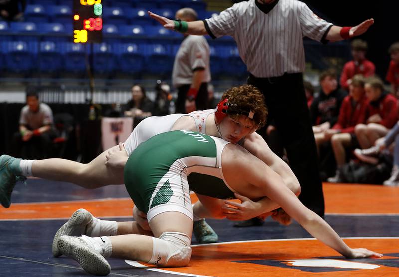 Marian Central's Dan French tries to control Coal City's Alec Waliczek during the IHSA Class 1A Dual Team Sate Championship match Saturday, Feb. 24, 2024 at Grossinger Motors Arena in Bloomington.