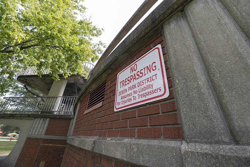 A no-trespassing sign is posted at Dixon's Memorial Pool.