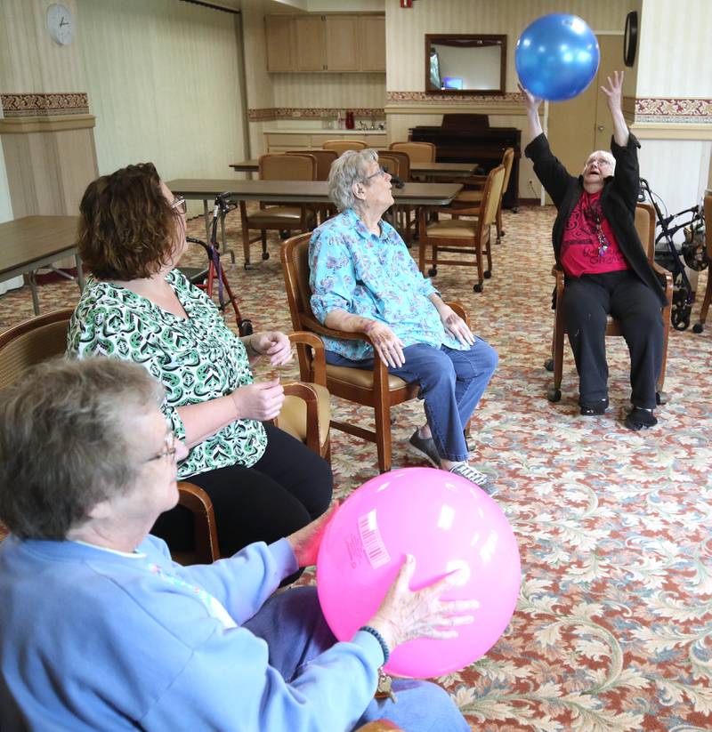 Barb City Manor resident Shirley Woody makes a catch during a scheduled activity Tuesday, July 2, 2024, at the retirement home in DeKalb. Barb City Manor celebrated its 45th anniversary earlier this year.