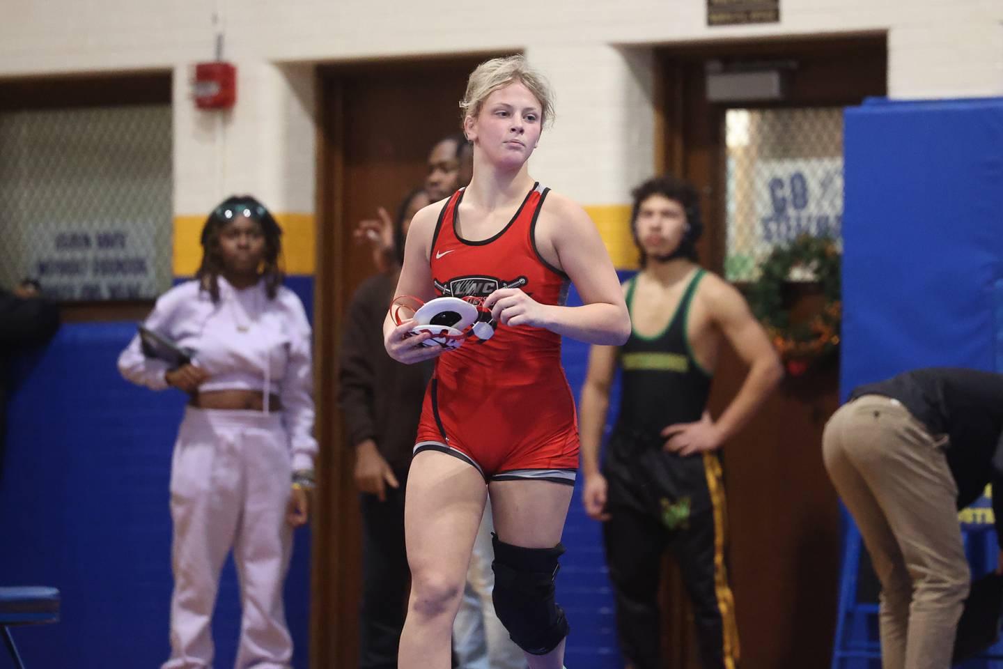 Lincoln-Way Central’s Gracie Guarino leave the mat after her win in the Joliet Central McLaughlin Classic on Saturday, Dec. 2, 2023 in Joliet.