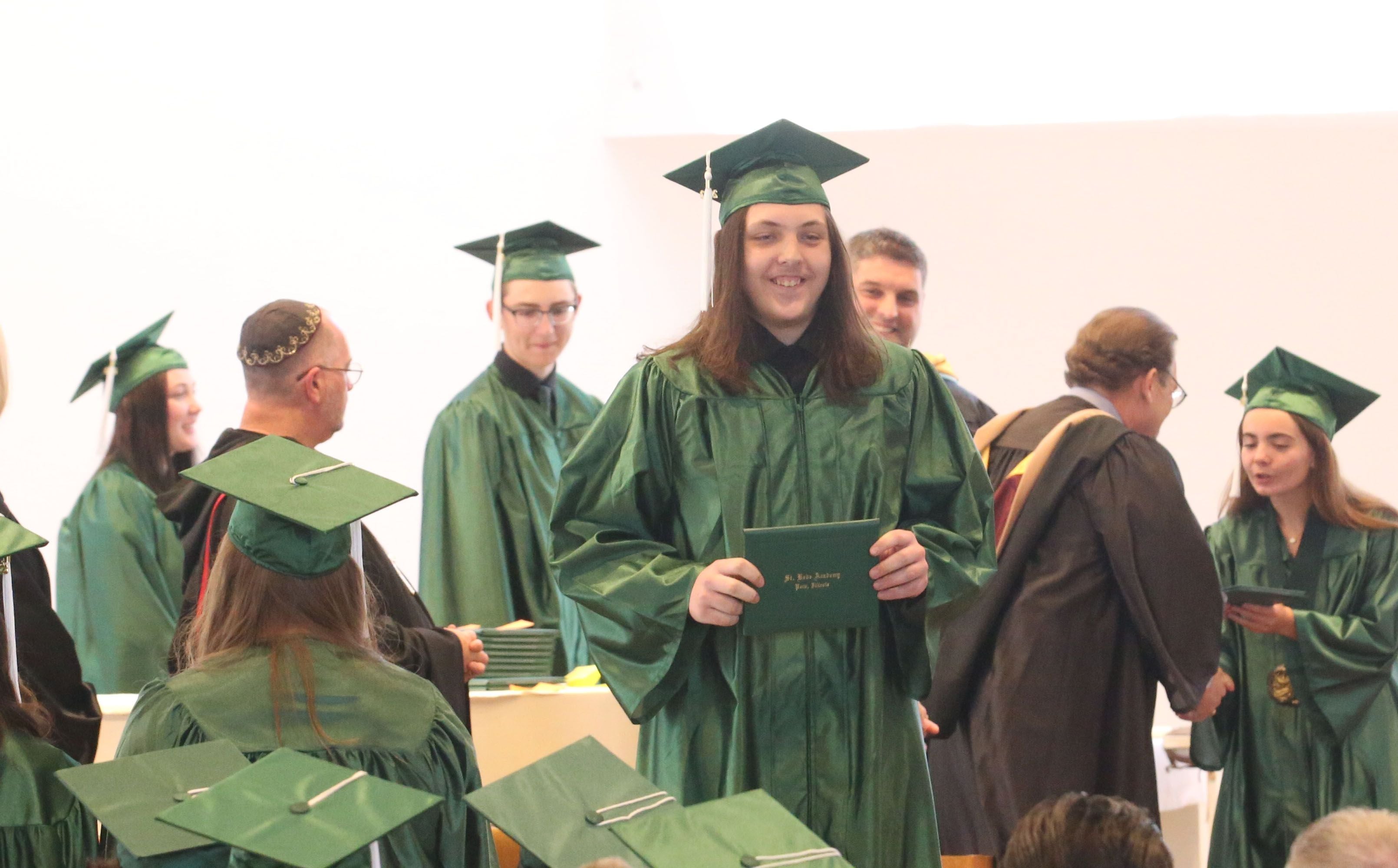 St. Bede senior Evan Fitzpatrick receives his diploma during the Class of 2023 graduation ceremony on Sunday, May 21, 2023, in the Abbey Church at the academy.