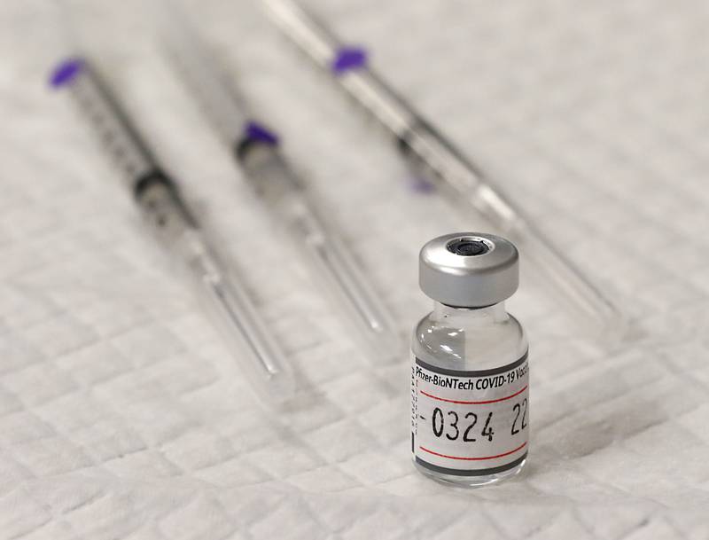 A vial of the Piizer-BioNTech Covid-19 vaccine at a vaccination clinic Monday, Jan. 24, 2022, at the Algonquin Township office, 3702 Route 14 in Crystal Lake. The clinic was put on by the township to help people get they vaccine, after the Omicron variant made getting shots at other locations harder.