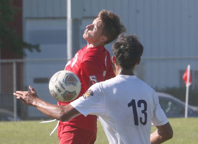 Streator's Blake Fialko misses a header as Mendota's Sebastian Carlos defends on Saturday, Aug. 31, 2024 at James Street Recreation Area in Streator.