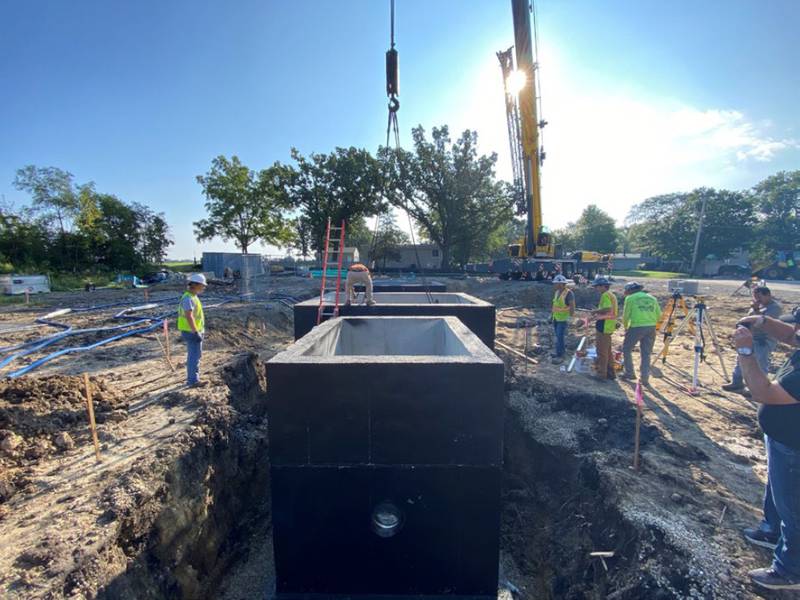 Crews place structures in September 2022 as part of Holiday Hills' sewer project, connecting the village to the Northern Moraine Water Reclamation District.