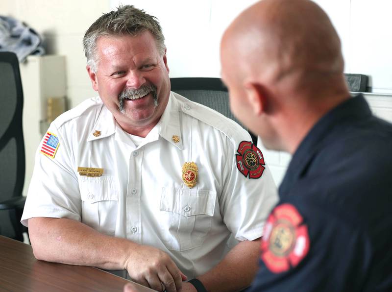 Sycamore Fire Chief Bart Gilmore (left) talks to Ian Wheeler, a firefighter/paramedic with the department, Tuesday, June 11, 2024, at Sycamore Fire Station 1.