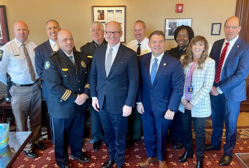 Kendall County State’s Attorney Eric Weis (second from left, back row)  joined other state’s attorneys, police chiefs and sheriffs to meet with Senate President Don Harmon (second from left front row) and Deputy Leader Linda Holmes (far right front row) in Springfield in March to speak on  funding of programs for children that prevent crime and reduce recidivism.