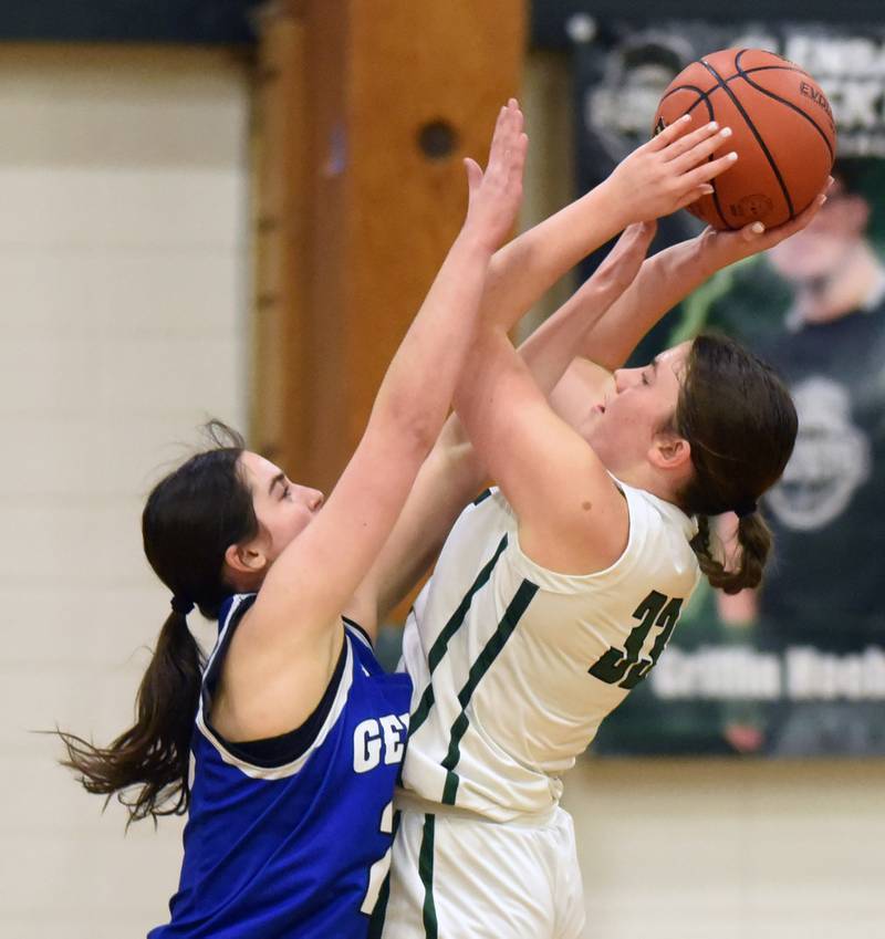 Geneva’s Lucie Garner, left, closely guards Glenbard West’s Anna Keller during the Glenbard West Class 4A girls basketball regional final on Thursday, Feb. 15, 2024 in Glen Ellyn.