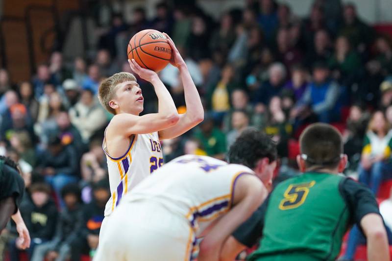 Downers Grove North's Alex Miller (25) shoots a free throw late in the 4th quarter of play during a Class 4A East Aurora sectional semifinal basketball game against Waubonsie Valley at East Aurora High School on Wednesday, Feb 28, 2024.