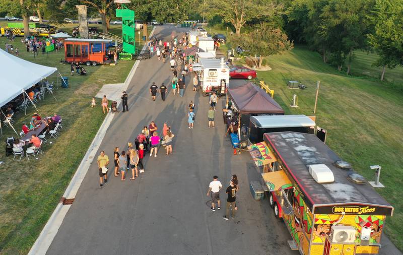 Several vendors serve food during the Taste of the Illinois Valley on Friday, Aug. 4, 2023 at Centennial Park in Peru.