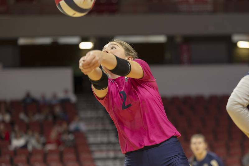 IC Catholic’s Alysa Lawton plays a shot against Carmi- White County in the 2A state semifinal Friday, Nov. 10, 2023 at CEFCU Arena in Normal.