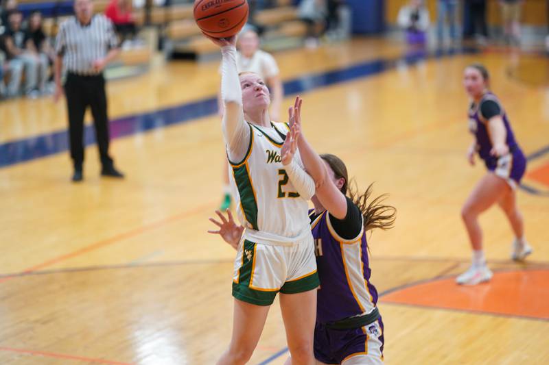 Waubonsie Valley's Lily Newton (23) shoots the ball in the paint against Downers Grove North during a Oswego semifinal sectional 4A basketball game at Oswego High School on Tuesday, Feb 20, 2024.