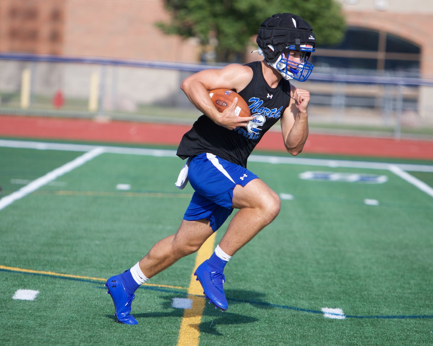 St. Charles North's Ethan Plumb carries the ball during the first day of practice on Monday Aug.12,2024 in St. Charles.