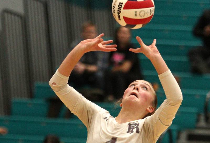 Prairie Ridge’s Alli Rogers sets the ball against Woodstock in IHSA Class 3A sectional semifinal volleyball action at Woodstock North Monday.