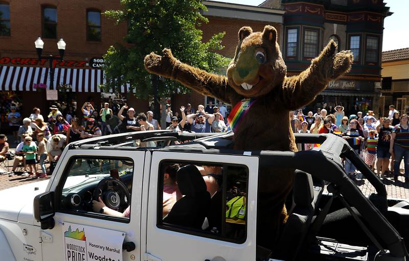 Woodstock Willie waves to the crowd during the Woodstock PrideFest Parade on Sunday, June 9, 2024, around the historic Woodstock Square.