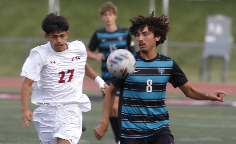 Woodstock North's Cesar Salas (right) tries to control the ball in front of Rockford East's Mohammad Hassan during a nonconference soccer match on Thursday, Sept. 5, 2024, at Huntley High School.