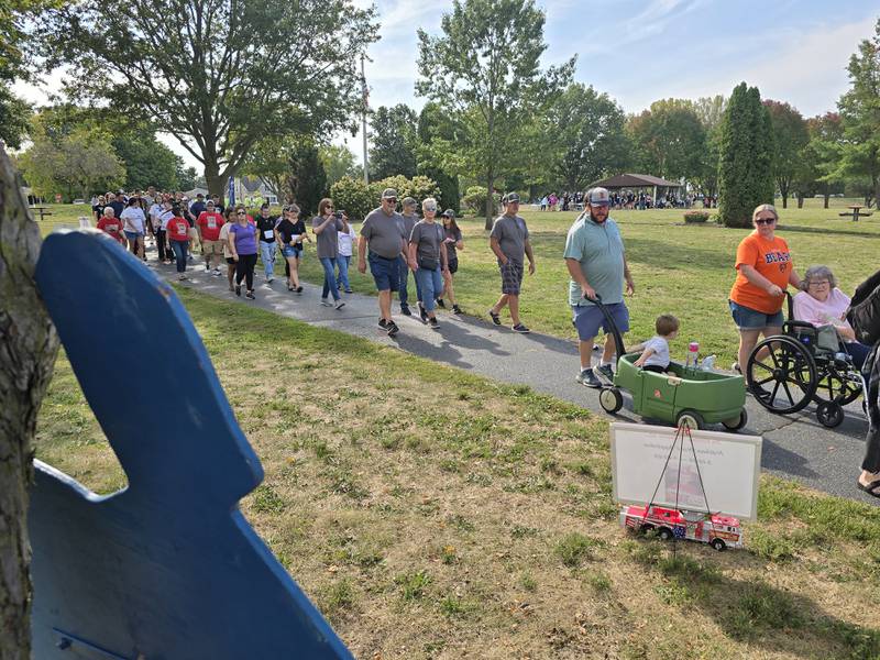 Walkers participate Sunday, Sept. 15, 2024, at the Compassionate Friends Walk to Remember at Baker Lake in Peru.