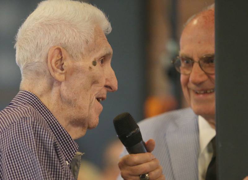 Dale Pienta, a Hall High School graduate, Tiskilwa track coach and Illinois Valley Community College basketball coach speaks with emcee Lanny Slevin during the Illinois Valley Sports Hall of Fame awards banquet on Thursday, June 6, 2024 at the Auditorium Ballroom in La Salle.