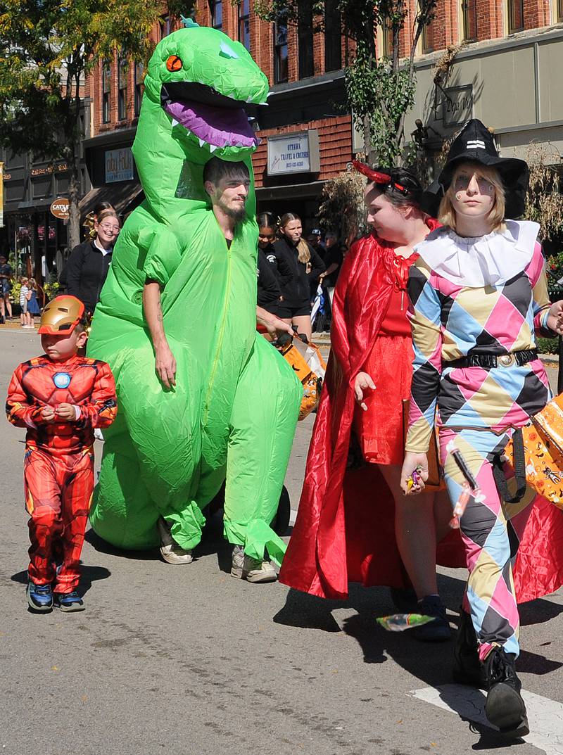 Variety of costumed characters marched and handed out treats Sunday during the Fall Festival  Parade in Ottawa.