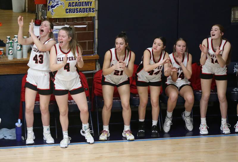 Members of the Amboy girls basketball team cheer on their teammates during the Class 1A Regional semifinal game on Monday, Feb. 12, 2024 at Marquette High School.