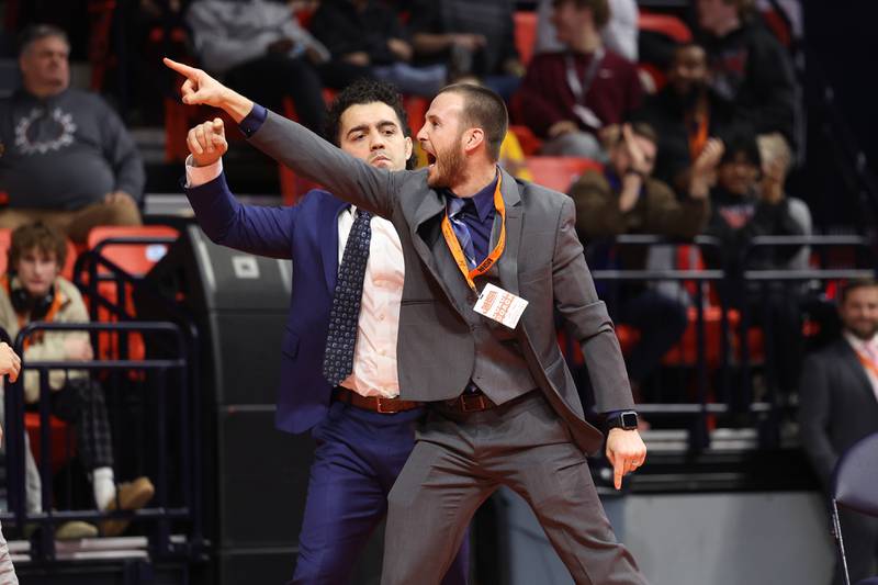 Marmion coach points to the stands after Nicholas Garcia win over St. Charles East’s Dom Munaretto in the 113-pound Class 3A state championship match on Saturday, Feb. 17th, 2024 in Champaign.