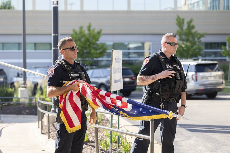 An Honor Guard waits outside OSF Medical Center in Rockford on Friday, June 14, 2024, to honor Lt. Jason Ketter.