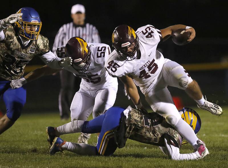 Johnsburg's Dominic Vallone tries to tackle Richmond-Burton's Braxtin Nellessen during a Kishwaukee River Conference football game on Friday, Oct.6, 2023, at Johnsburg High School.