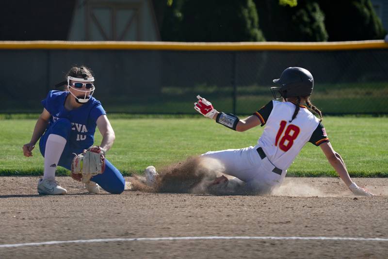 Batavia’s Gwen Shouse (18) steals second base against Geneva’s Kaitlyn Sprague (10) during a softball game at Batavia High School on Wednesday, May 8, 2024.