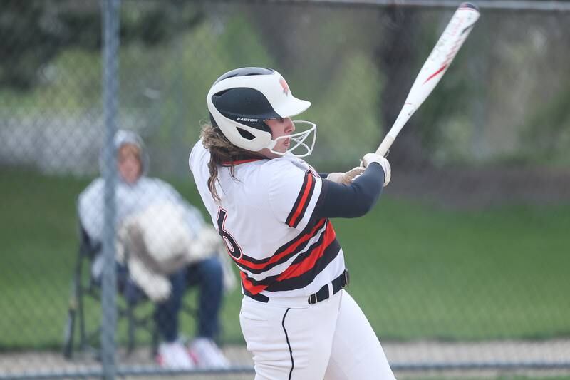 Minooka’s Karli McMillin connects for a single against Oswego on Wednesday, April 17, 2024 in Minooka.