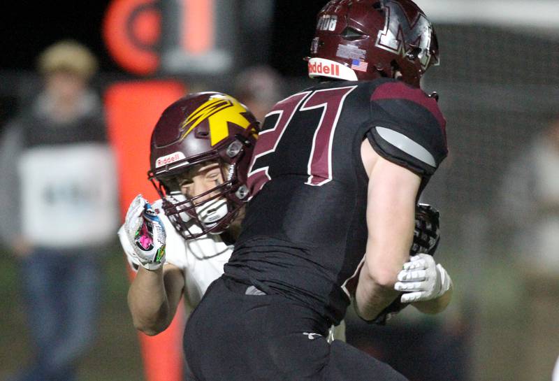 Richmond Burton’s Hunter Carley tackles Marengo’s Connor Sacco in varsity football at Rod Poppe Field on the campus of Marengo High School in Marengo on Friday, Oct. 18, 2024.