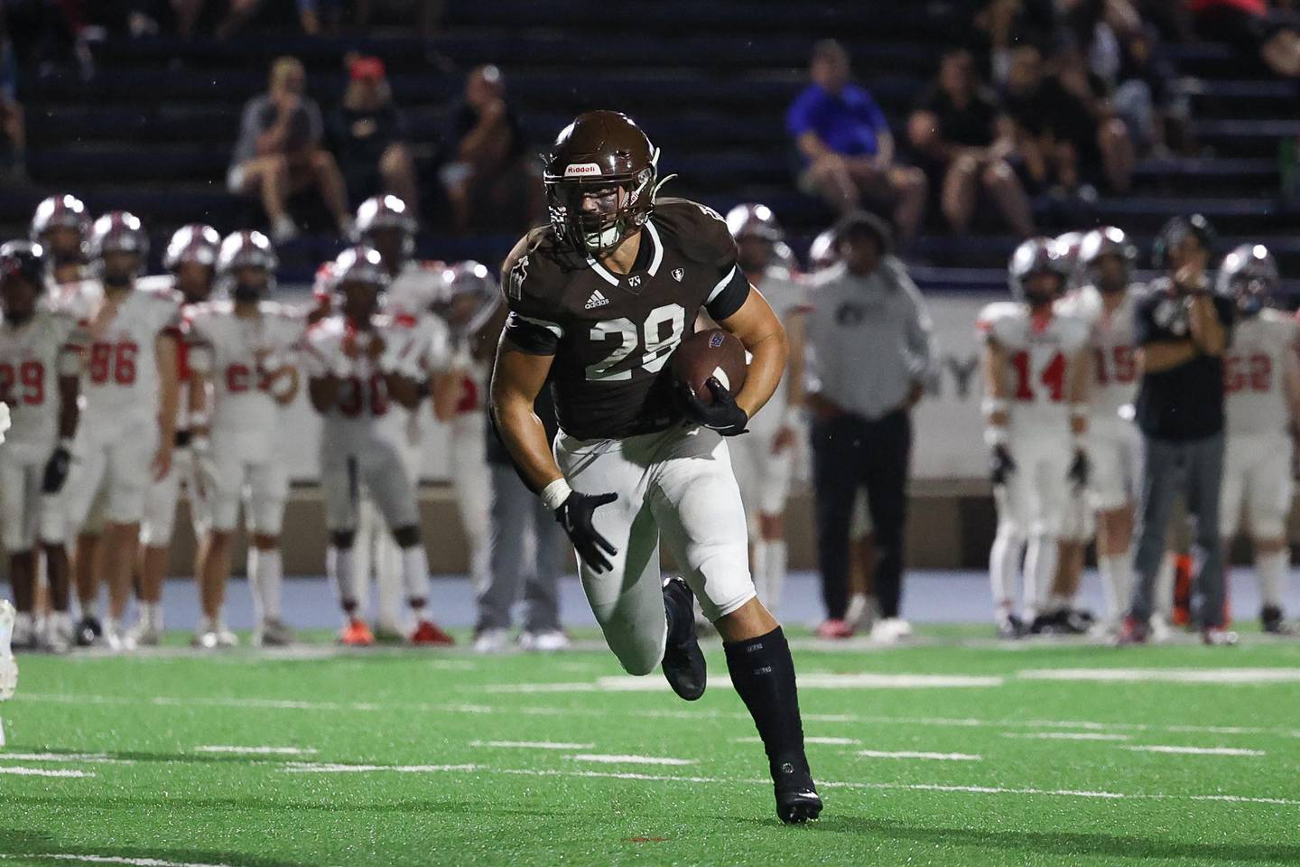 Joliet Catholic’s Nate Magrini rushes to the outside against Iowa City on Friday, August 30, 2024 in Joliet.