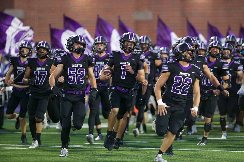 Downers Grove North takes the field against Downers Grove South on Friday Sept. 6,2024 in Downers Grove.