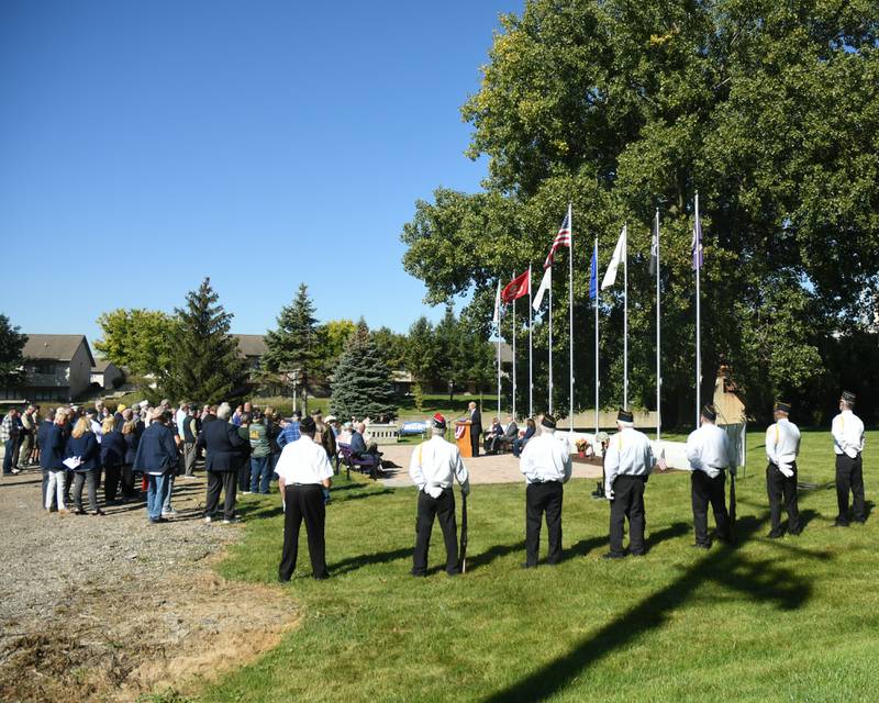 Air Force veteran Michael Embrey gives remarks as area veterans and onlookers gather during a dedication ceremony marking the completion of phase one of the DeKalb Elks Veteran’s Memorial Plaza in DeKalb Saturday, Oct. 1, 2022.