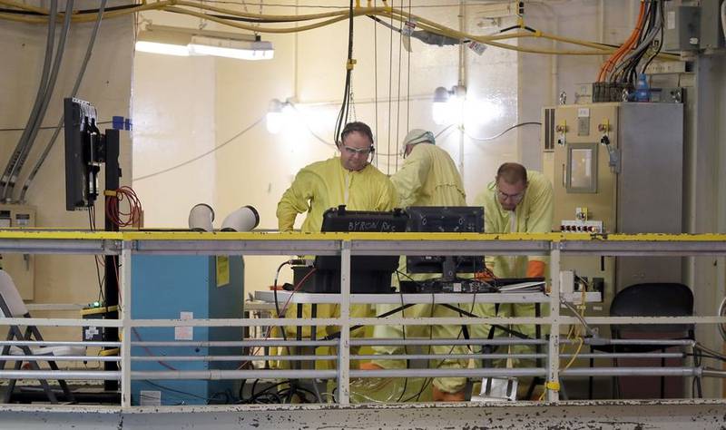 Employees remove and replace spent fuel in the cooling pool at the Byron Generating Station Tuesday, Oct. 17, 2023, in Byron.