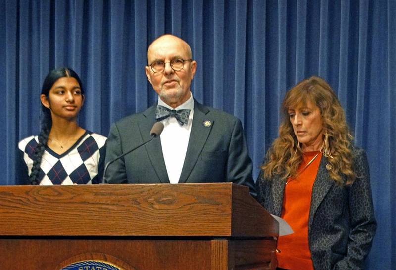 Democratic state Sens. Dave Koehler, center, and Linda Holmes discuss a bill they are pushing to make sure children who appear in their parents’ revenue-generating videos receive a share of the those revenues. It is an idea brought to them by a high school student from Normal, Shreya Nallamothu, left.