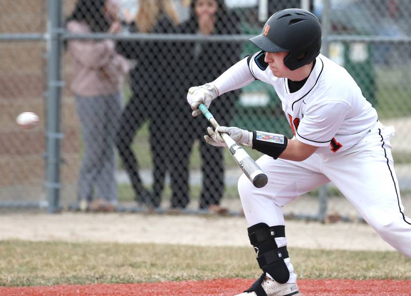 DeKalb's Matthew Clayton tries to get a bunt down during their game against East Aurora Wednesday, March 13, 2024, at DeKalb High School.