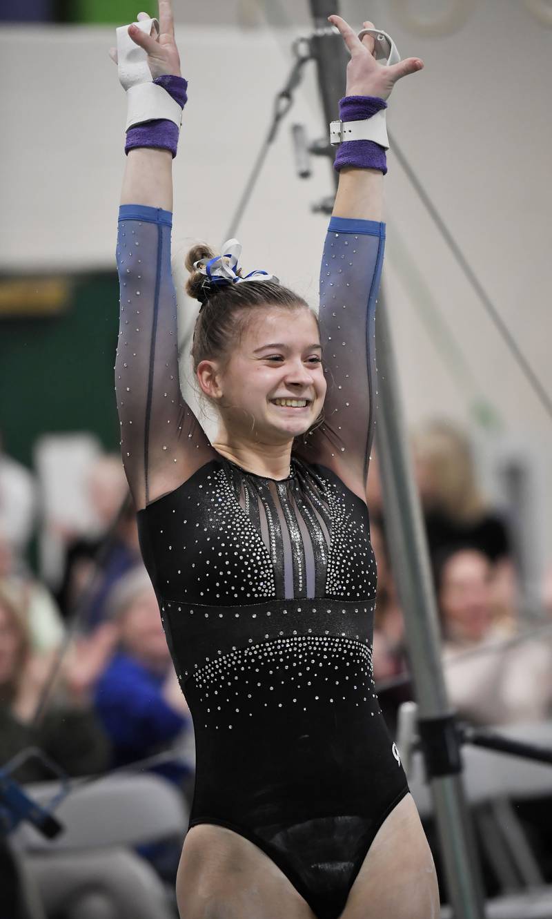 Geneva’s Brooke Lessnig after her performance on the uneven parallel bars at the Glenbard West girls gymnastics regional meet in Glen Ellyn on Wednesday, January 31, 2024.