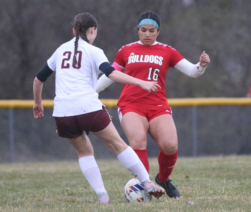 Morris's Nicolette Boelman kicks the ball away from Streator's Zulima Gonzalez on Monday, March 25, 2024 at the James Street Recreation Area in Streator.