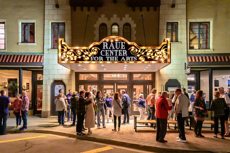 An audience gathers outside the Raue Center For The Arts in Crystal Lake.